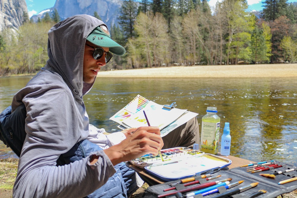 Watercolor painting class beside a lake in Yosemite